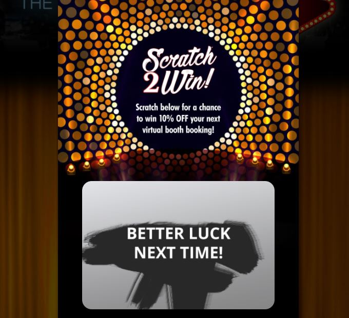 A digital Scratch to Win contest interface on a Social Booth touch screen, featuring a vibrant gold background and a digital scratch-off card revealing a prize result during a gamified corporate brand activation.