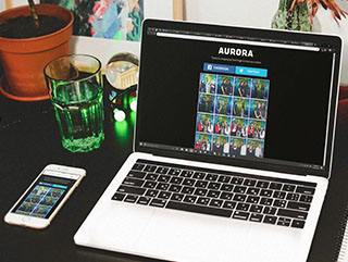 An image of a laptop dislaying a microsite live gallery, offered exclusively by the Selfie Spot's Social Booth